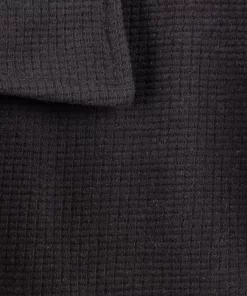 Црна голема поло блуза релјефен плетен матријал во големини од 8XL 9XL 10XL предна страна зголемена ткаенина